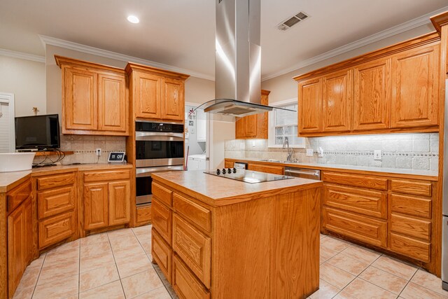 kitchen featuring island range hood, stainless steel appliances, visible vents, and light tile patterned flooring