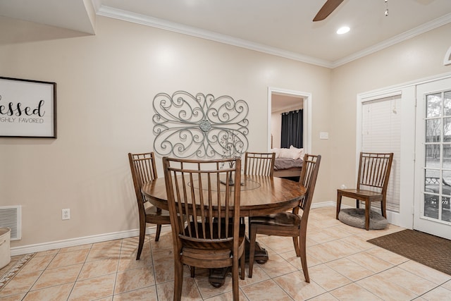 dining room featuring light tile patterned flooring, ceiling fan, ornamental molding, and visible vents