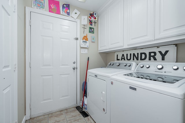 clothes washing area with washer and dryer, light tile patterned floors, and cabinet space