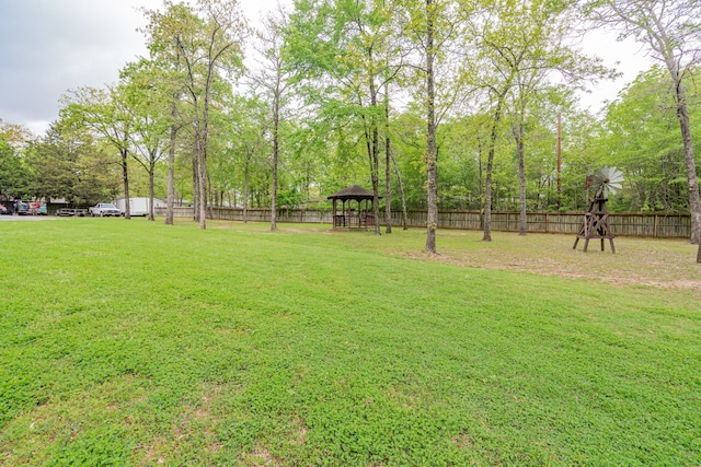 view of yard featuring a gazebo and fence