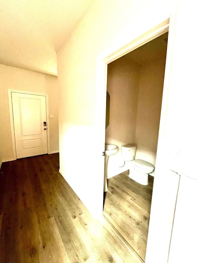 corridor with wood finished floors