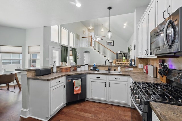 1236 Spanish Moss Dr, Savannah, TX 76227 - kitchen with stainless steel gas range oven, a sink, black dishwasher, a ceiling fan, and dark countertops