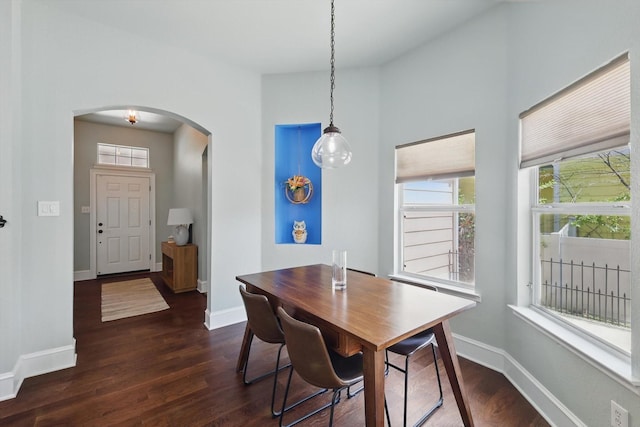 1236 Spanish Moss Dr, Savannah, TX 76227 - dining room featuring arched walkways, dark wood finished floors, and plenty of natural light