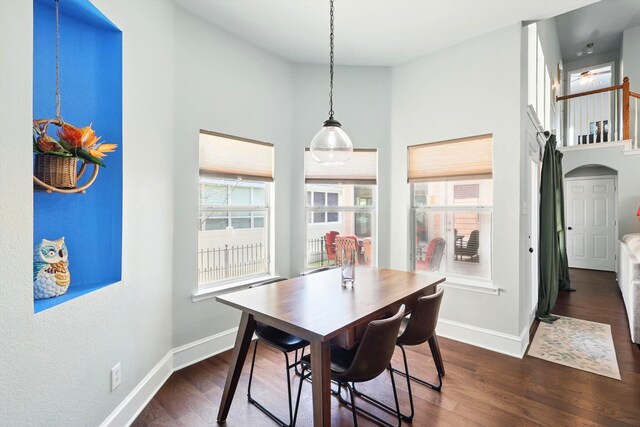 1236 Spanish Moss Dr, Savannah, TX 76227 - dining area featuring plenty of natural light, dark wood-style floors, baseboards, and a towering ceiling