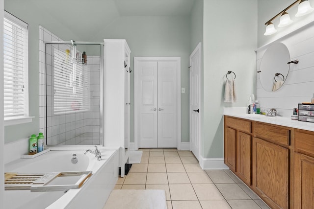 1236 Spanish Moss Dr, Savannah, TX 76227 - bathroom with a stall shower, vanity, tile patterned flooring, a garden tub, and vaulted ceiling