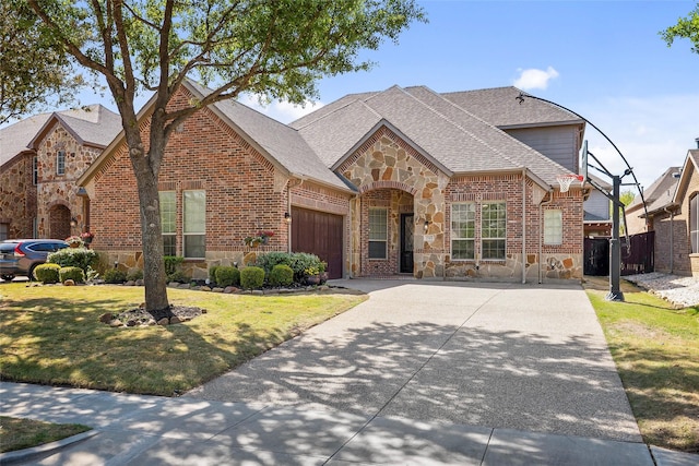 2542 Morgan Ln, Trophy Club, TX 76262 - french country inspired facade with stone siding, a garage, brick siding, and roof with shingles