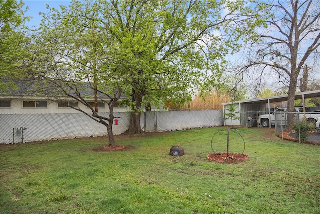2107 Elizabeth Dr, Brownwood, TX 76801 - view of yard with an outdoor structure, fence, and an outbuilding