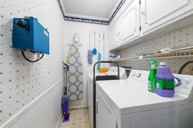 2107 Elizabeth Dr, Brownwood, TX 76801 - laundry room featuring a textured ceiling, wainscoting, wallpapered walls, washer and clothes dryer, and light floors