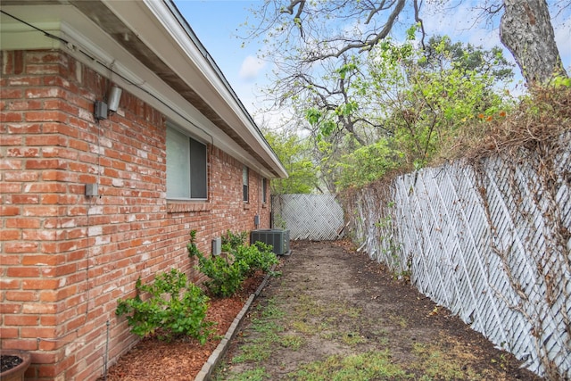 2107 Elizabeth Dr, Brownwood, TX 76801 - view of property exterior with a fenced backyard and brick siding