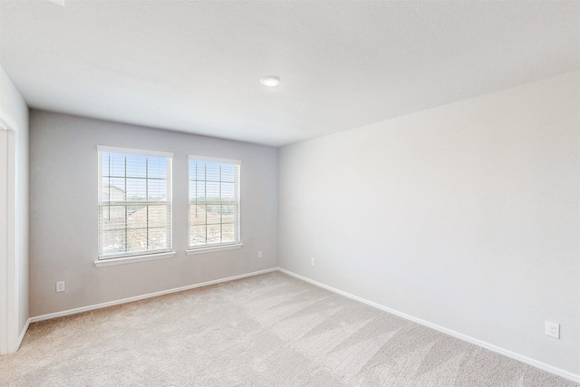 1813 Osage Trl, Mesquite, TX 75149 - spare room with light carpet and baseboards