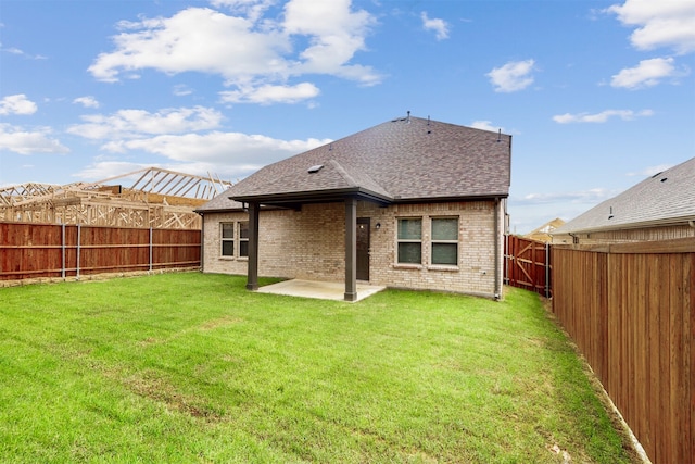 1813 Osage Trl, Mesquite, TX 75149 - back of property with roof with shingles, brick siding, and a patio