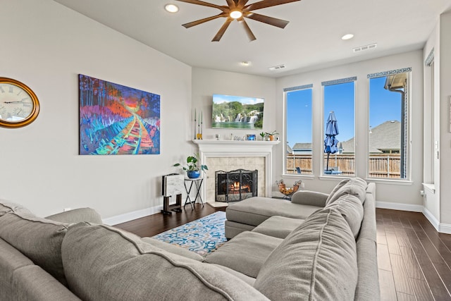 1036 Wedgewood Dr, Forney, TX 75126 - living area featuring a ceiling fan, baseboards, a tile fireplace, dark wood finished floors, and recessed lighting