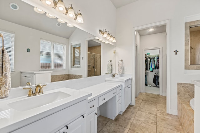 1036 Wedgewood Dr, Forney, TX 75126 - bathroom featuring a stall shower, a bath, vanity, a walk in closet, and tile patterned floors