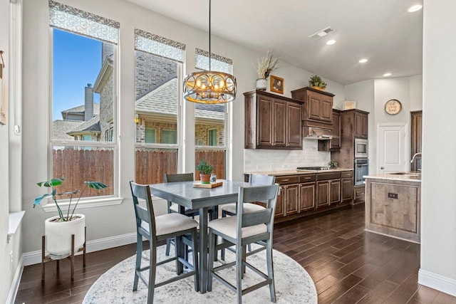 1036 Wedgewood Dr, Forney, TX 75126 - dining space with baseboards, dark wood-type flooring, a chandelier, and recessed lighting