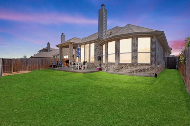1036 Wedgewood Dr, Forney, TX 75126 - back of house with brick siding, a chimney, and a patio area