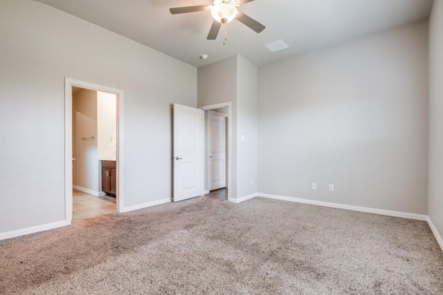 5219 Amistad Ave, Royse City, TX 75189 - unfurnished bedroom with light carpet, baseboards, ensuite bath, and a ceiling fan