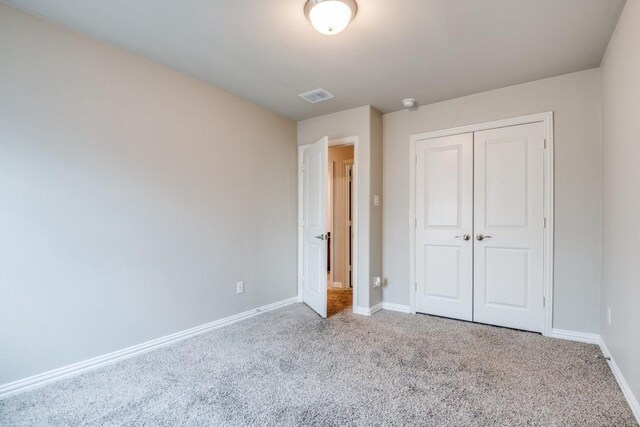 5219 Amistad Ave, Royse City, TX 75189 - unfurnished bedroom with carpet floors, baseboards, and a closet