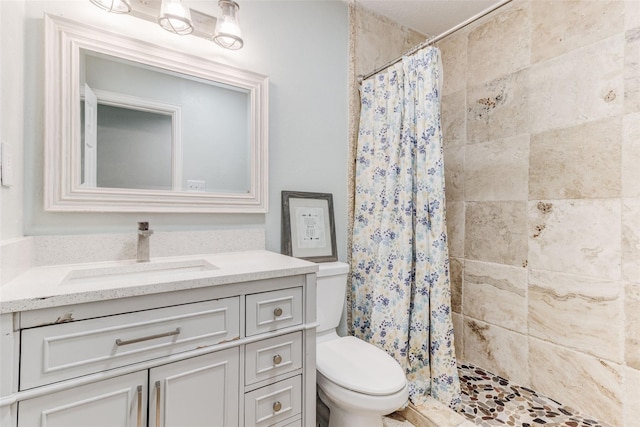 4842 Stallcup Dr, Mesquite, TX 75150 - bathroom featuring toilet, tiled shower, and vanity