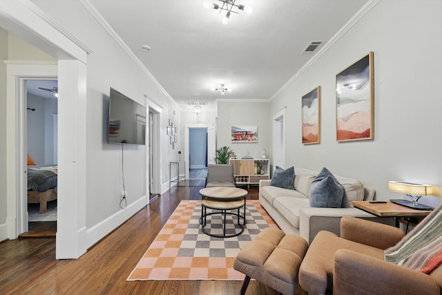 living area with ornamental molding, baseboards, dark wood-style floors, and visible vents