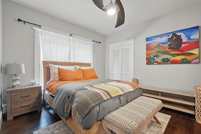 bedroom featuring a closet, a ceiling fan, and wood finished floors