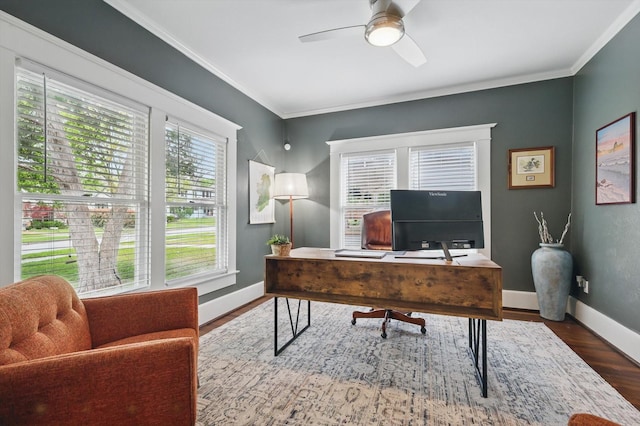 home office featuring baseboards, ornamental molding, a ceiling fan, and wood finished floors