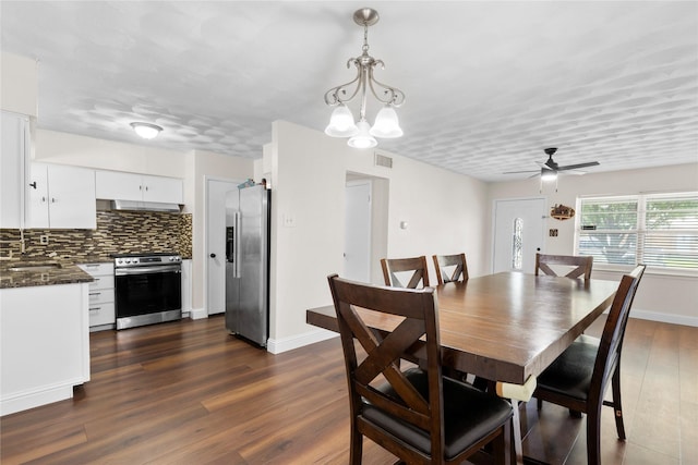 4109 Timberline Dr, Garland, TX 75042 - dining room with a ceiling fan, dark wood-style flooring, and a chandelier