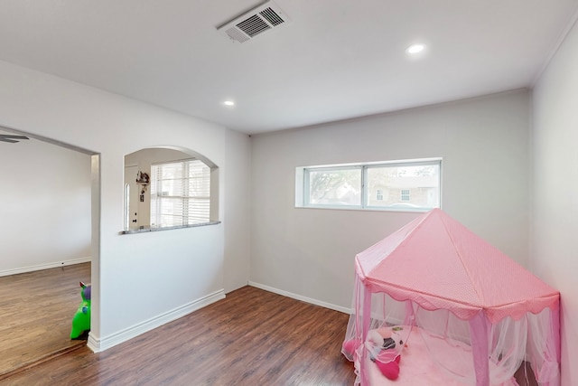 game room with baseboards, recessed lighting, visible vents, arched walkways, and wood finished floors