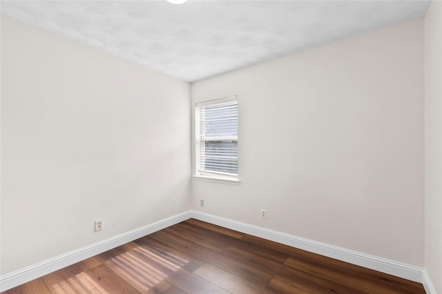 4109 Timberline Dr, Garland, TX 75042 - unfurnished room featuring baseboards and dark wood-type flooring