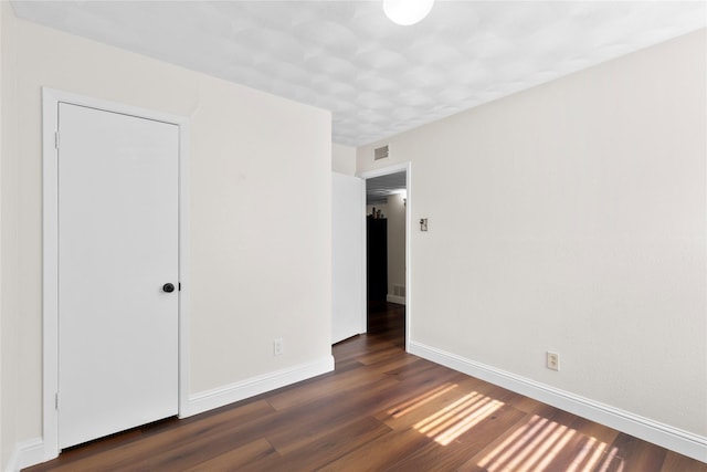 4109 Timberline Dr, Garland, TX 75042 - unfurnished bedroom featuring wood finished floors and baseboards