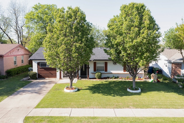 view of front of property with brick siding, a front yard, driveway, and roof with shingles