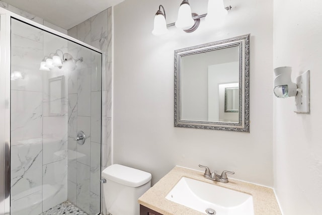 full bathroom with toilet, vanity, and a marble finish shower
