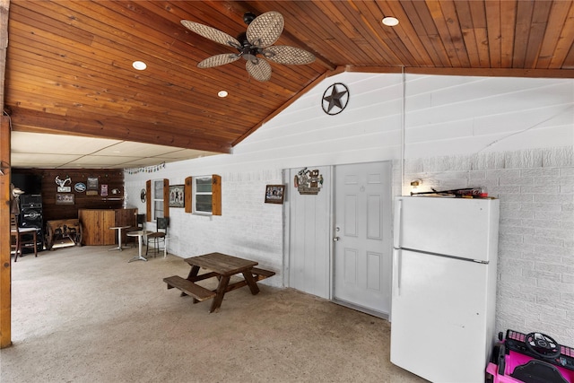 4109 Timberline Dr, Garland, TX 75042 - living area featuring a ceiling fan, lofted ceiling, wooden ceiling, carpet flooring, and brick wall