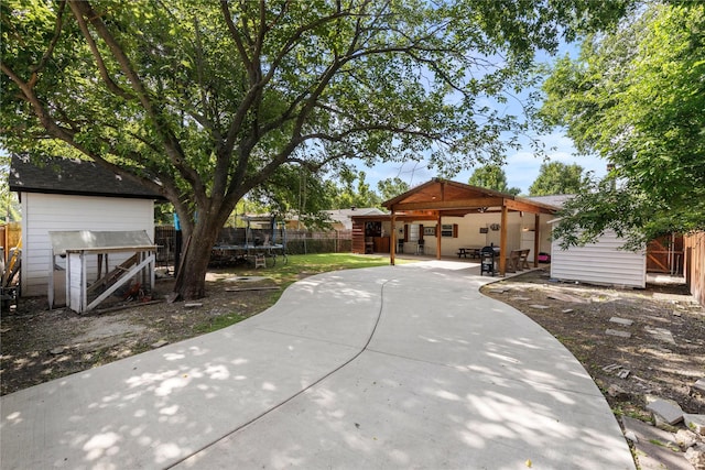 4109 Timberline Dr, Garland, TX 75042 - back of property featuring a trampoline, a patio area, and a fenced backyard