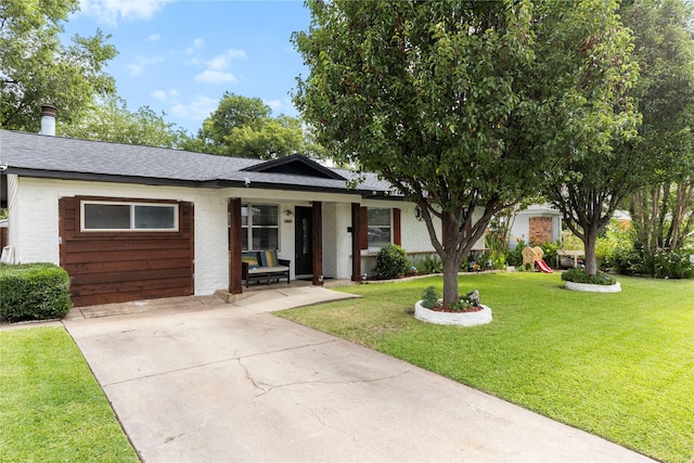 4109 Timberline Dr, Garland, TX 75042 - single story home with brick siding, a porch, a front yard, concrete driveway, and a shingled roof
