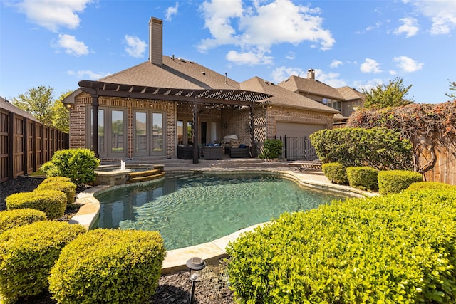 429 S Hampton Ct, Lewisville, TX 75056 - view of pool with a pergola, a pool with connected hot tub, a fenced backyard, a patio, and french doors