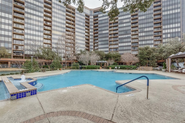 pool featuring a gazebo and a patio area