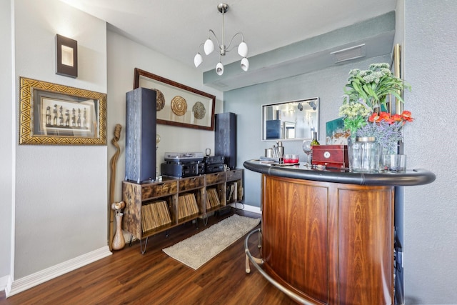 bar featuring visible vents, baseboards, and dark wood-style floors