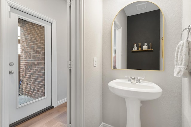 bathroom with wood finished floors