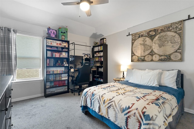 carpeted bedroom with baseboards, multiple windows, and a ceiling fan