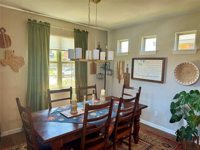 dining space featuring baseboards