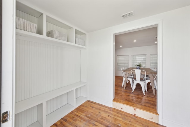 mudroom with recessed lighting, visible vents, and wood finished floors