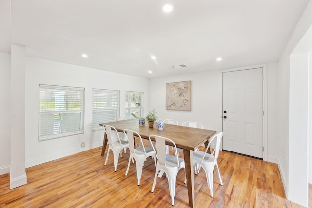 dining room featuring visible vents, baseboards, recessed lighting, and light wood-style floors