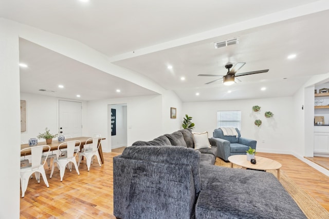 living room with recessed lighting, visible vents, ceiling fan, and light wood-style flooring