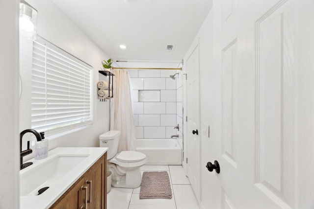 bathroom with vanity, tile patterned flooring, visible vents, toilet, and shower / tub combo