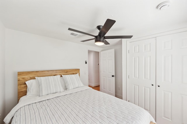 bedroom featuring visible vents, a closet, and a ceiling fan