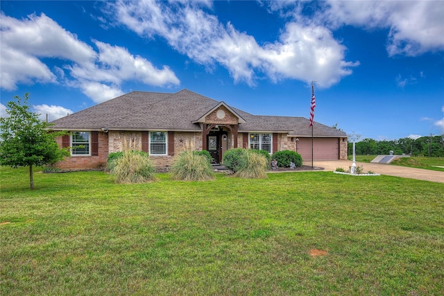 ranch-style house with an attached garage, a front lawn, brick siding, and driveway