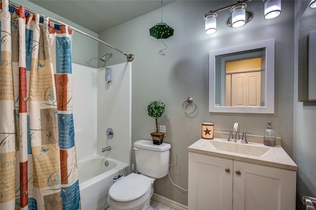bathroom featuring toilet, baseboards, shower / tub combo, and vanity