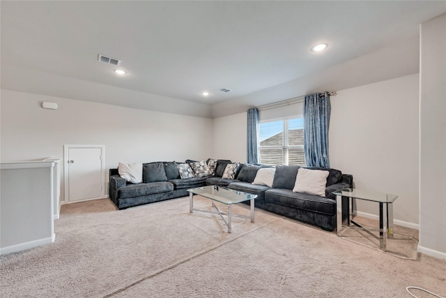carpeted living area with recessed lighting, visible vents, and baseboards