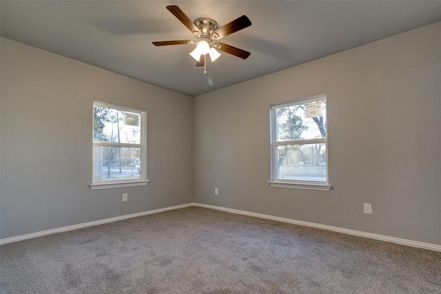 702 N Virginia, Terrell, TX 75160 - carpeted empty room with ceiling fan, baseboards, and a wealth of natural light