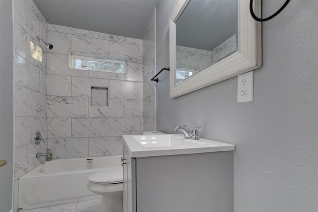 702 N Virginia, Terrell, TX 75160 - full bath with shower / washtub combination, toilet, a textured wall, vanity, and marble finish floor
